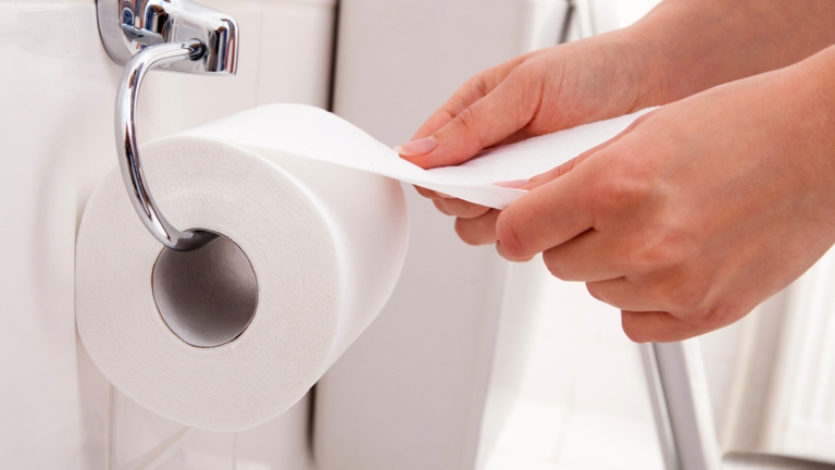 stock-photo-hand-holding-toilet-paper-at-home-173971583.jpg
