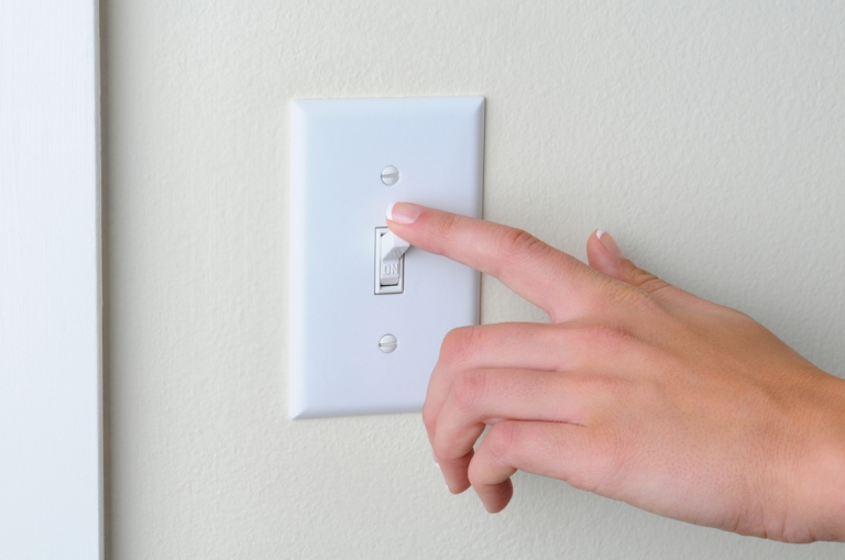 stock-photo-womans-hand-with-finger-on-light-switch-about-to-turn-off-the-lights-closeup-of-hand-and-switch-95322187